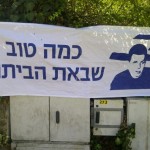 These posters were hung all over Jerusalem says "How good is the coming home."
